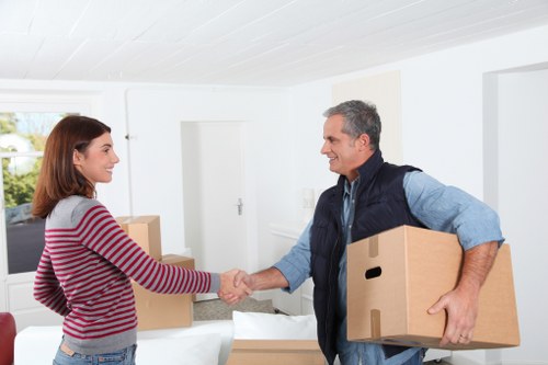 Professional movers handling furniture with care