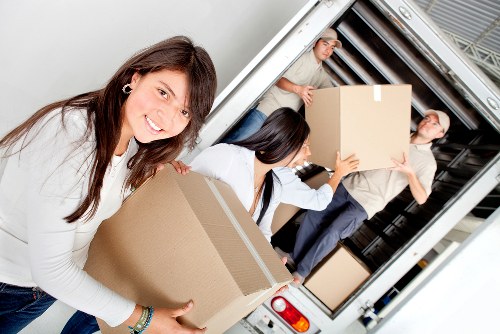 Smiling mover concluding a successful relocation in Belsize Park